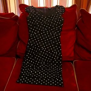 White House Black Market slimming,flattering black with white polka-dots. Size 0